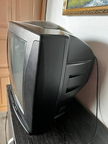 LG телевизор черного цвета с плоским экраном и компактным корпусом