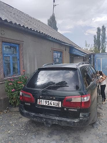 бампер тарнео: Mazda 626: 1992 г., Автомат, Универсал — 5