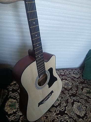 Музыкалык аспаптар: Акустическая гитара типа дредноут с вырезом (cutaway) — 3