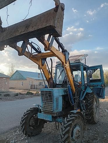 Фронтальный погрузчик на базе колёсного трактора - Колёсная формула