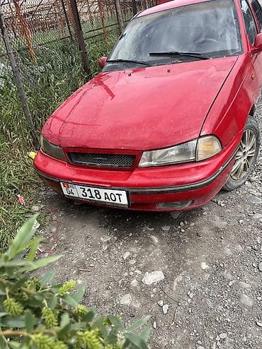 тез арада: Daewoo Nexia: 2006 г., Кол менен иштөөчү, Бензин, Седан — 5