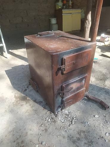 Металлическая твердотопливная печь-буржуйка. очень экономичная