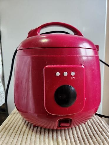 рисоварка: Рисоварка чугунная компактная, красного цвета. Основные особенности — 1