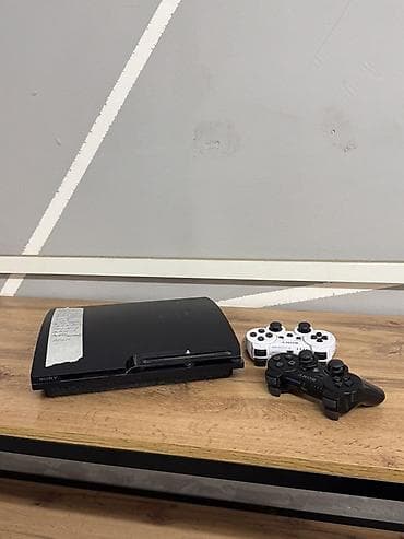 game controller: Sony PlayStation 3 (Slim). Игровая приставка с жёстким диском 149 ГБ — 1