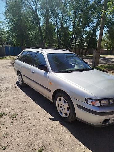 глушитель на макси: Mazda 626: 1998 г., 1.8 л, Механика, Бензин, Универсал — 5