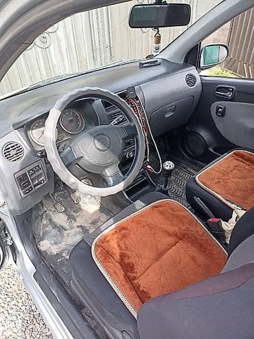 дайхатсу мув: Daihatsu Cuore: 2003 г., 0.9 л, Ручные, Бензин, Купе — 7