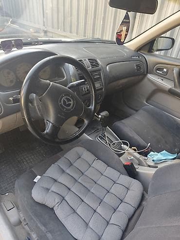 Mazda 323: 2003 г., 1.6 л, Автомат, Бензин, Седан