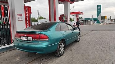 Транспорт: Mazda Cronos: 1996 г., 1.8 л, Кол менен иштөөчү, Бензин, Хетчбек — 5
