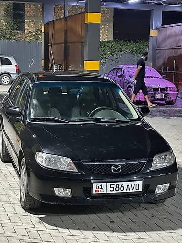 Mazda 323: 2001 г., 1.6 л, Механика, Бензин, Седан