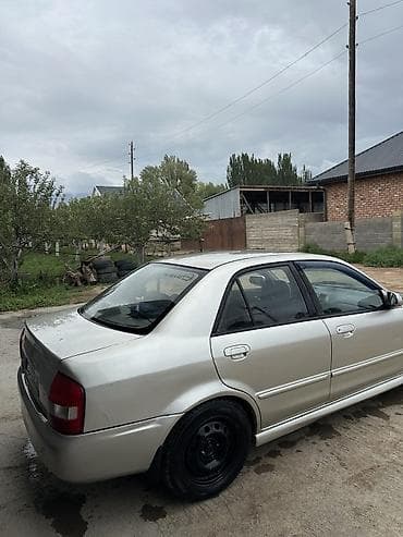 Унаа: Mazda 323: 2002 г., 1.6 л, Кол менен иштөөчү, Бензин, Седан — 3