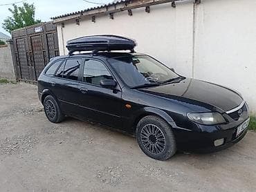 Mazda 323: 2002 г., 1.6 л, Автомат, Бензин, Универсал — 1