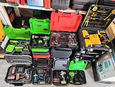 Cordless Tool Kits in Cases. Description: - Various professional tool