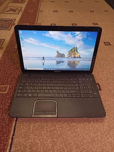 Ноутбук Toshiba Satellite 15.6" батарея держит около часа. Основные