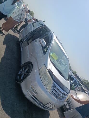 купить альфард в бишкеке: Серебристый минивэн Toyota Alphard с тонированными задними стеклами и — 1