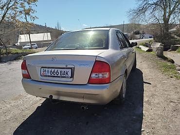 демио некся: Mazda 323: 2002 г., 1.6 л, Механика, Бензин, Седан — 3