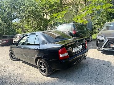 e klass: Mazda 323: 2002 г., 1.5 л, Автомат, Бензин, Седан — 2