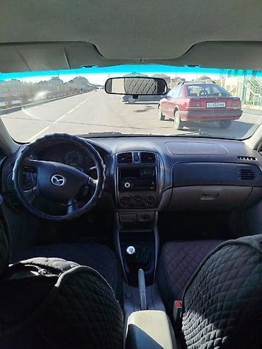 Унаа: Mazda 323: 2001 г., 1.6 л, Кол менен иштөөчү, Бензин, Хетчбек — 6