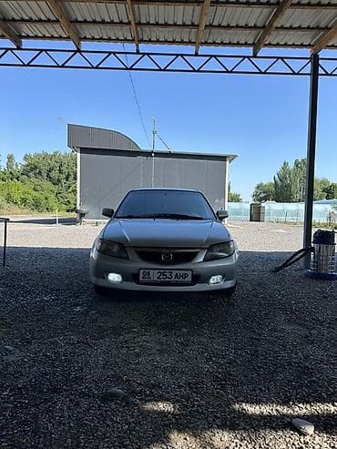 yamaha n max: Mazda 323: 2003 г., 1.6 л, Механика, Бензин, Хэтчбэк — 1