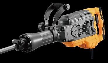 Строительное оборудование: Отбойный молоток в черно-оранжевом корпусе с дополнительной рукояткой — 2