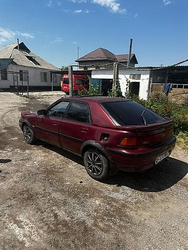 sequoia 2010: Mazda 323: 1994 г., 1.6 л, Механика, Бензин, Хэтчбэк — 1
