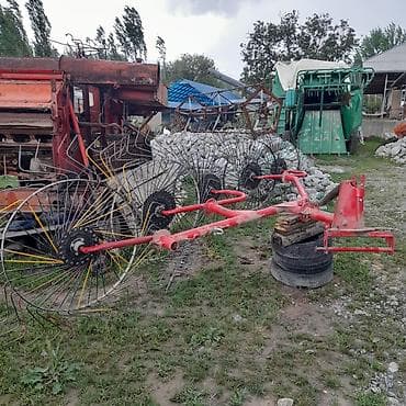 Транспорт: Грабли-ворошилки колесно-пальцевые, прицепные к трактору. Описание: - — 6