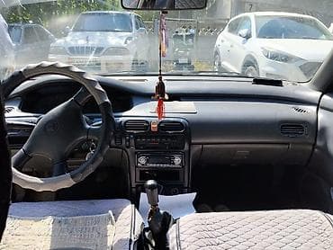 колпачки: Mazda Cronos: 1992 г., 2 л, Механика, Бензин, Седан — 4