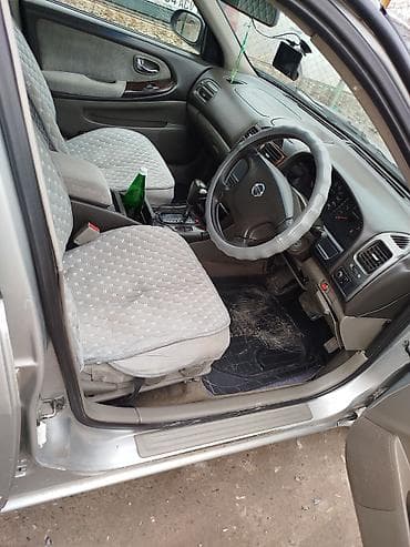 нексия рестайлинг: Седан серебристого цвета, 4 двери, просторный салон, черная тканевая — 7