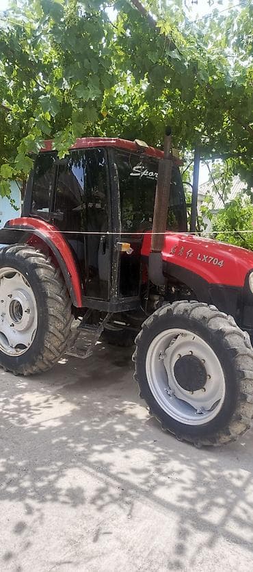 германский комбайн: Трактор Jinma LX704, колесная формула 4х4, с закрытой кабиной — 4