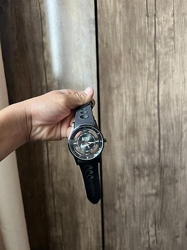 гармин феникс 6: Наручные часы Nike, спортивного стиля. - Круглый корпус черного цвета — 1