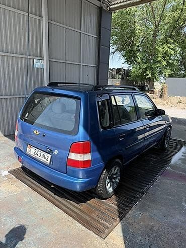 camry 2010: Mazda Demio: 1999 г., 1.3 л, Механика, Бензин, Универсал — 3