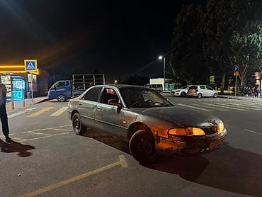 Транспорт: Mazda Cronos: 1993 г., 2 л, Механика — 1
