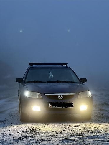 кытай мото: Mazda 323: 2000 г., 2 л, Кол менен иштөөчү, Дизель, Хетчбек — 1