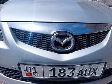 Автозапчасти: Решетка радиатора Mazda Оригинал — 1