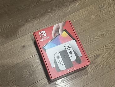 Nintendo Switch OLED: Nintendo Switch OLED (белая версия) Комплектация: - Консоль Nintendo — 4
