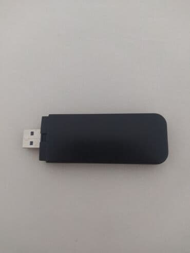 ремонт флешки: Портативный USB-модем черного цвета с матовой поверхностью, оснащенный — 2