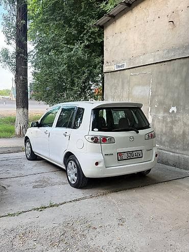 айни 95: Mazda Demio: 2005 г., 1.5 л, Автомат, Бензин — 8