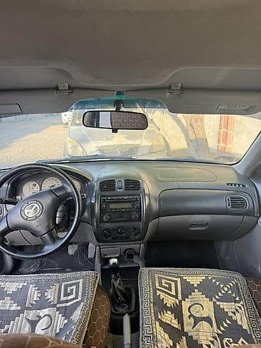 колонка microlab: Mazda 323: 2002 г., 1.6 л, Механика, Бензин, Универсал — 3