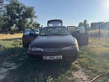 авто для такси: Mazda 626: 1994 г., 2 л, Механика, Бензин, Лифтбек — 1