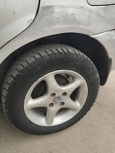 Mazda 323: 1999 г.