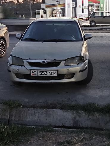 byd e2: Mazda 323: 1999 г., Механика, Бензин, Хэтчбэк — 1