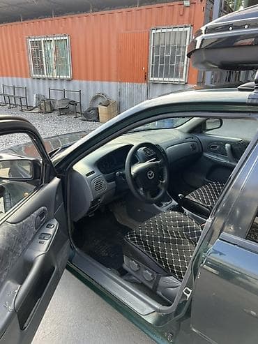 e 303: Mazda 323: 1999 г., 1.6 л, Механика, Бензин, Универсал — 10