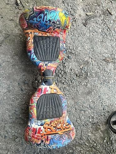 беговых дорожка: Гироскутер с ярким граффити-принтом. Особенности: - Диаметр колес — 1