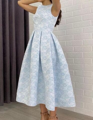 Продаю нежное платье новое цвет голубой качество шикарное по