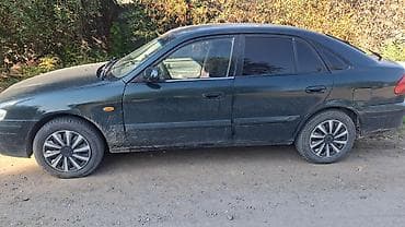 Mazda 626: 2000 г., 1.8 л, Кол менен иштөөчү, Бензин, Хетчбек — 3