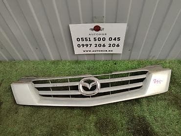 Решетка радиатора Mazda 2001 г., Оригинал