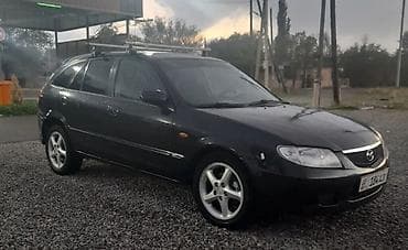 camry 75: Mazda 323: 2001 г., 2 л, Ручные, Бензин, Хэтчбэк — 3