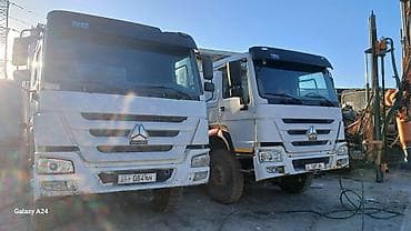 куплю мусоровоз: Самосвалы HOWO (CNHTC/SINOTRUK) 8×4 - Кузов-«ванна» большого объёма с — 1