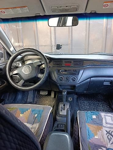 молдинг е39: Mitsubishi Lancer: 2005 г., Седан — 7