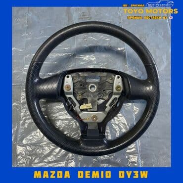 запчасти на мазду демио в бишкеке: Руль Mazda Б/у, Оригинал, Япония — 1