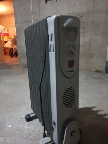 Стационарные телефоны: Масляный обогреватель Кол-во секций: 1, Отключение при перегреве, Быстрый нагрев, Встроенный вентилятор — 2